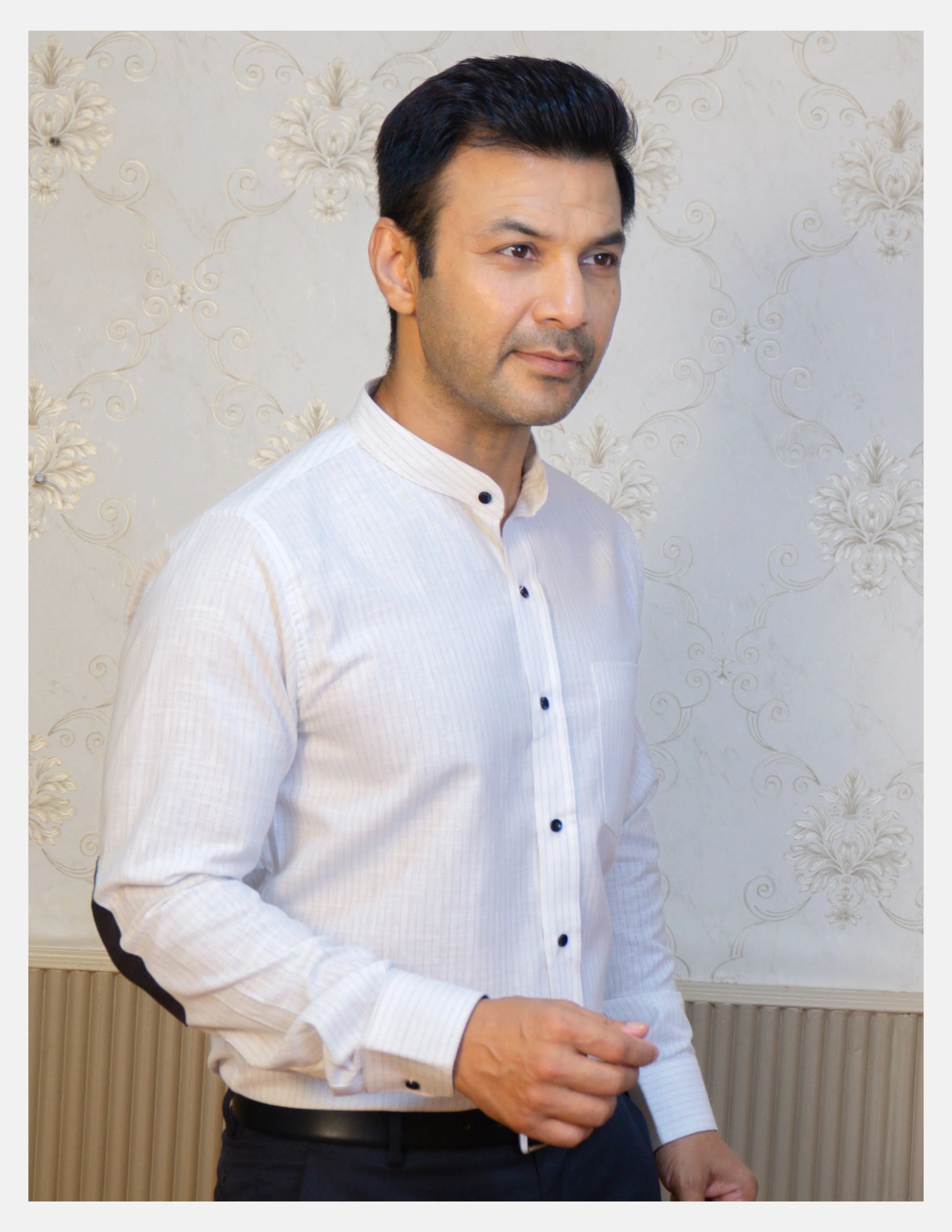 White Pinstripe Linen Shirt for Men – Mandarin Collar & Black Contrast Details | Dignity | Tucked-In Walking View