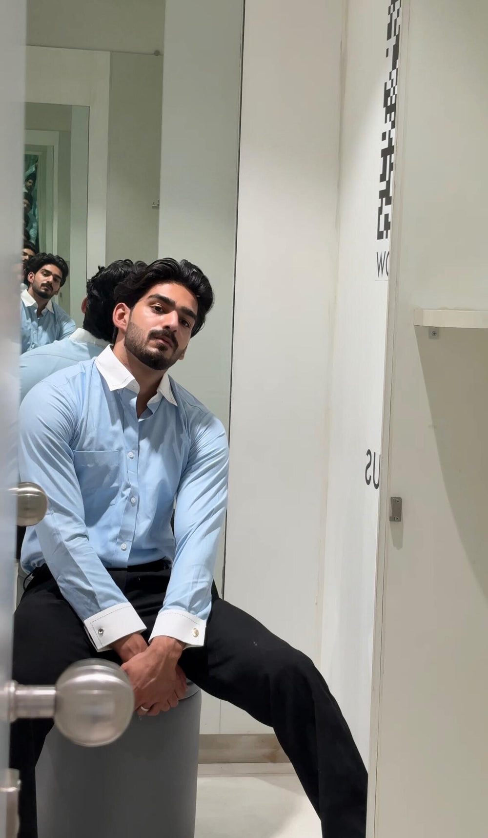 Aabid Tantray wearing the Dignity Light Blue Oxford Shirt