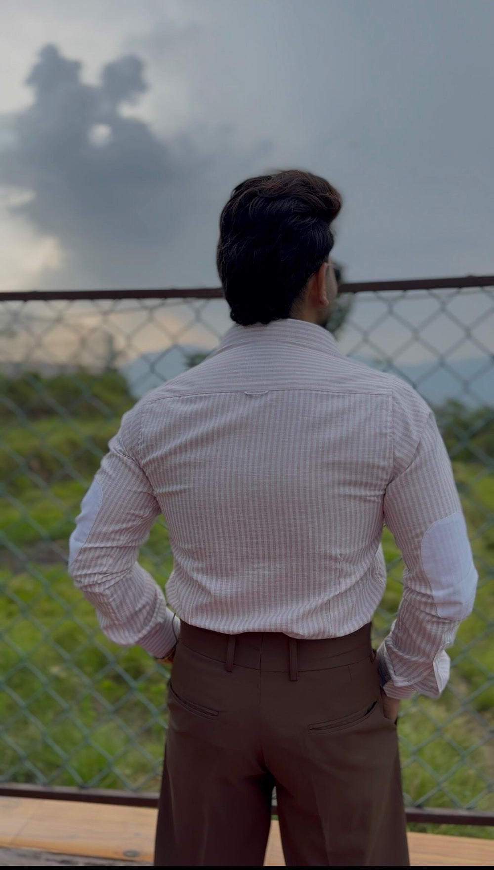 Ankit wearing the Dignity Pink Striped Linen Shirt